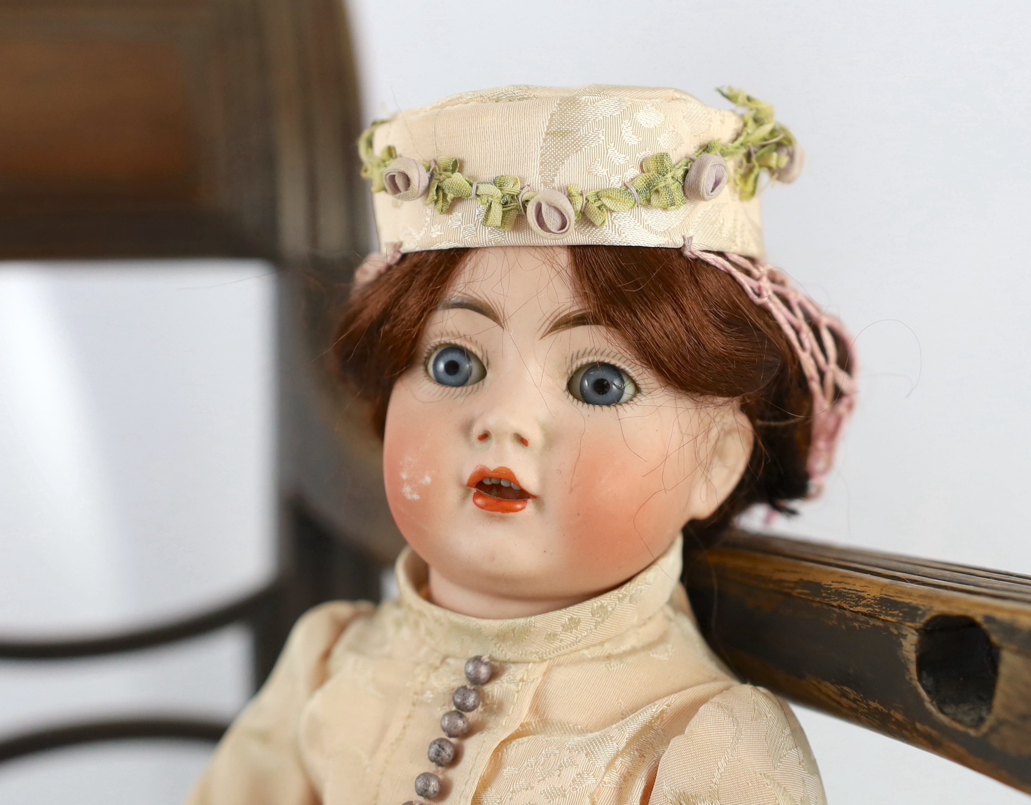 A Kammer & Reinhardt / Simon & Halbig bisque character doll, German, circa 1911, 13in. Please note the chair is for display purposes only.